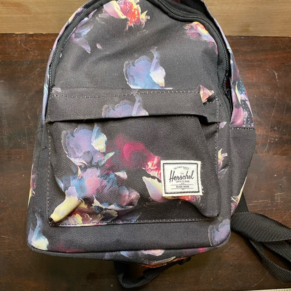 Herschel Black floral mini backpack great condition!! Great for any occasion